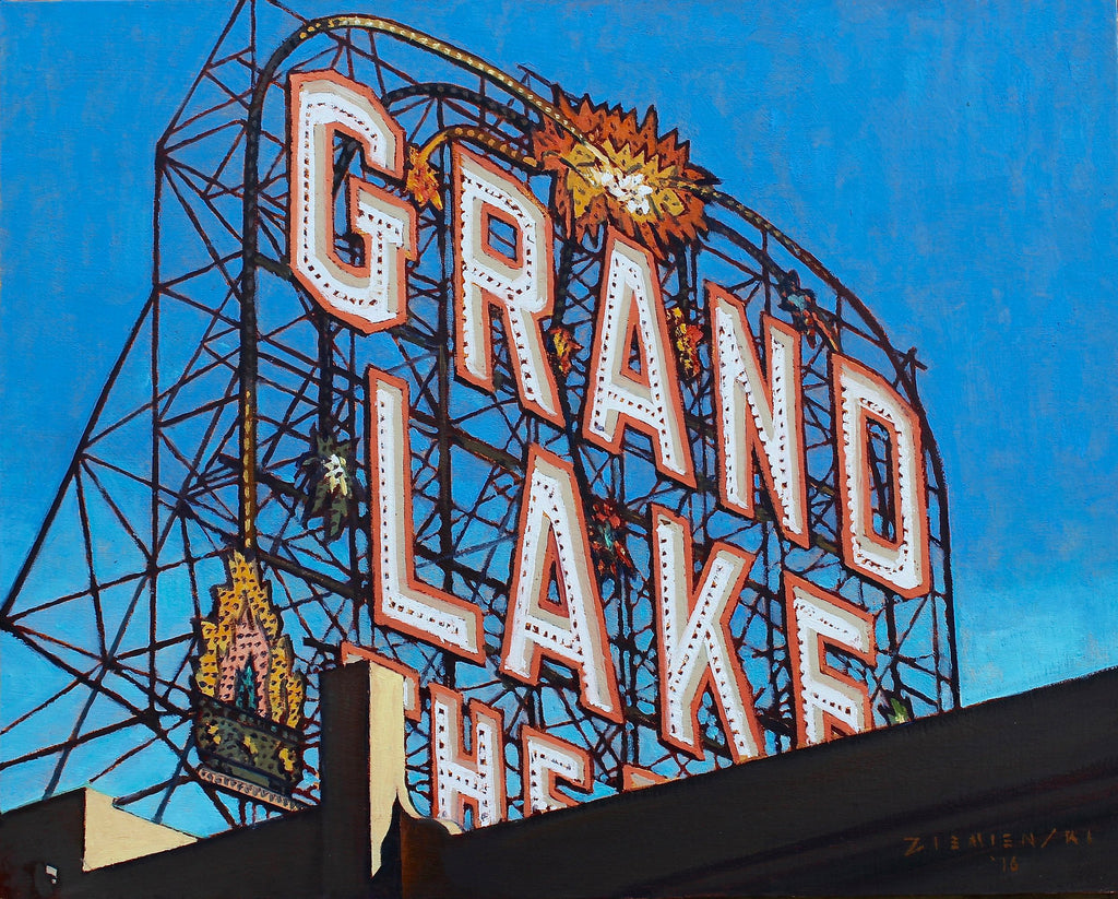 Neon sign for Grand Lake Theatre against a blue sky