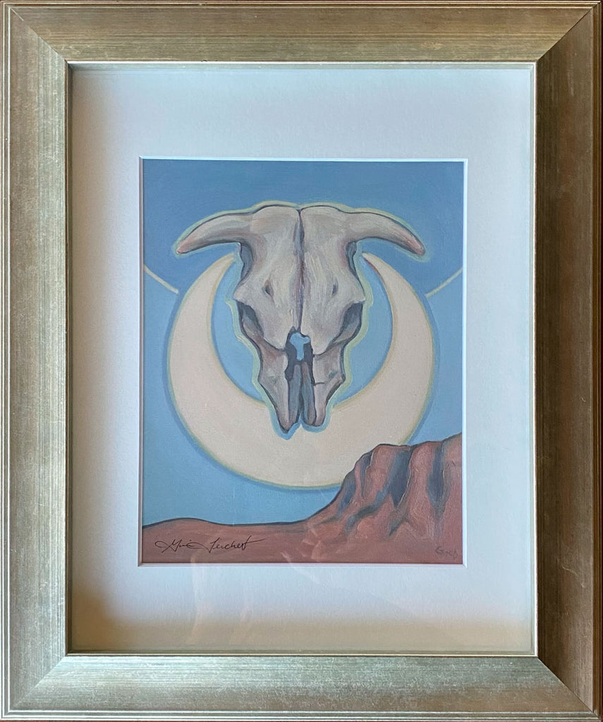 Print of a skull and cresent moon in a metallic frame