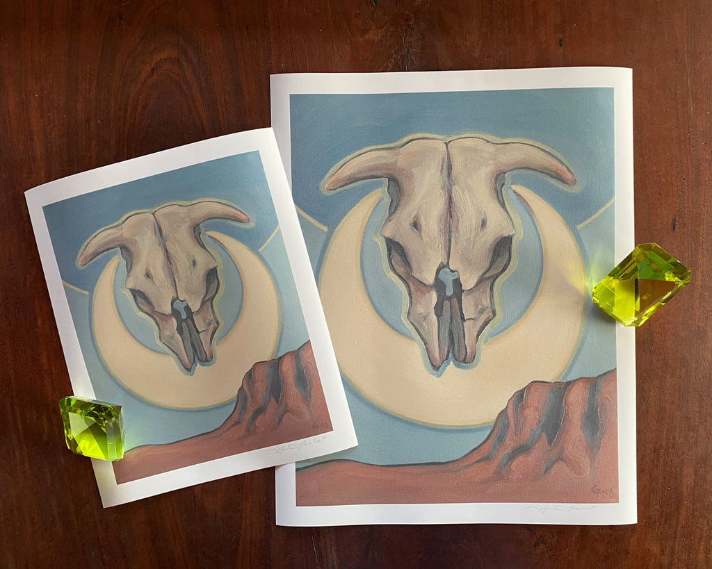 Skull print by Gina Teichert, skull floating over a desert landscape with a crescent moon
