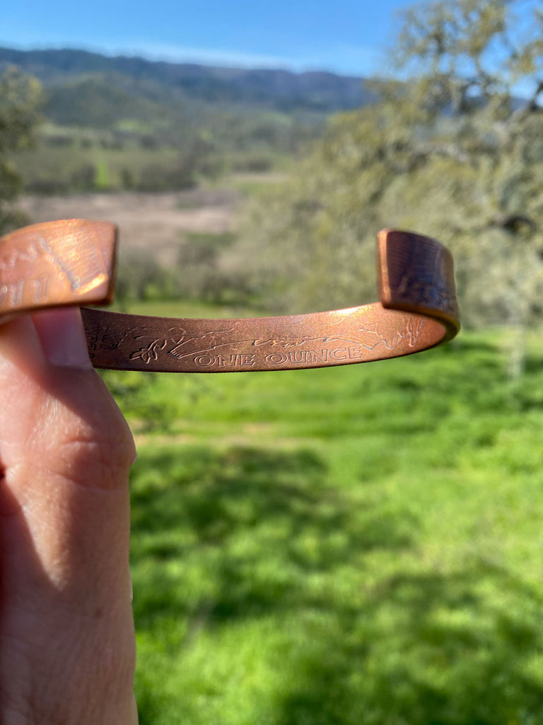 Solid copper bracelet with one ounce stamped on back