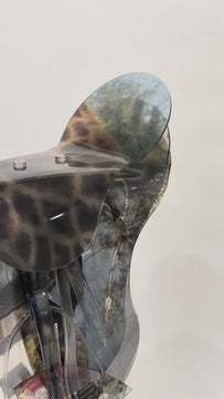 English saddle sculpture with giraffe print 
