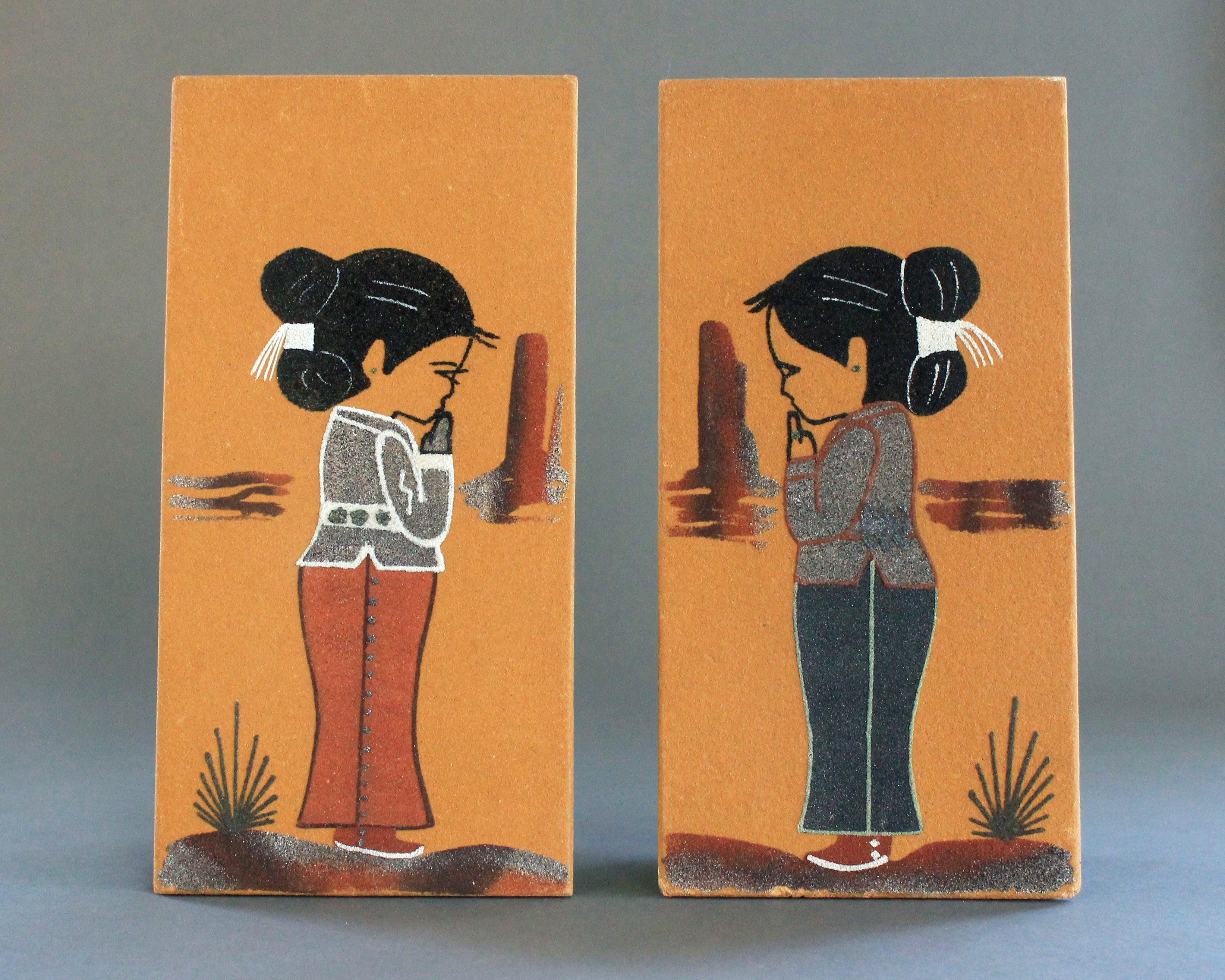 Navajo sand paintings of a boy and a girl by Sadie Akee 