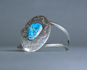 Turquoise bracelet with large concho design