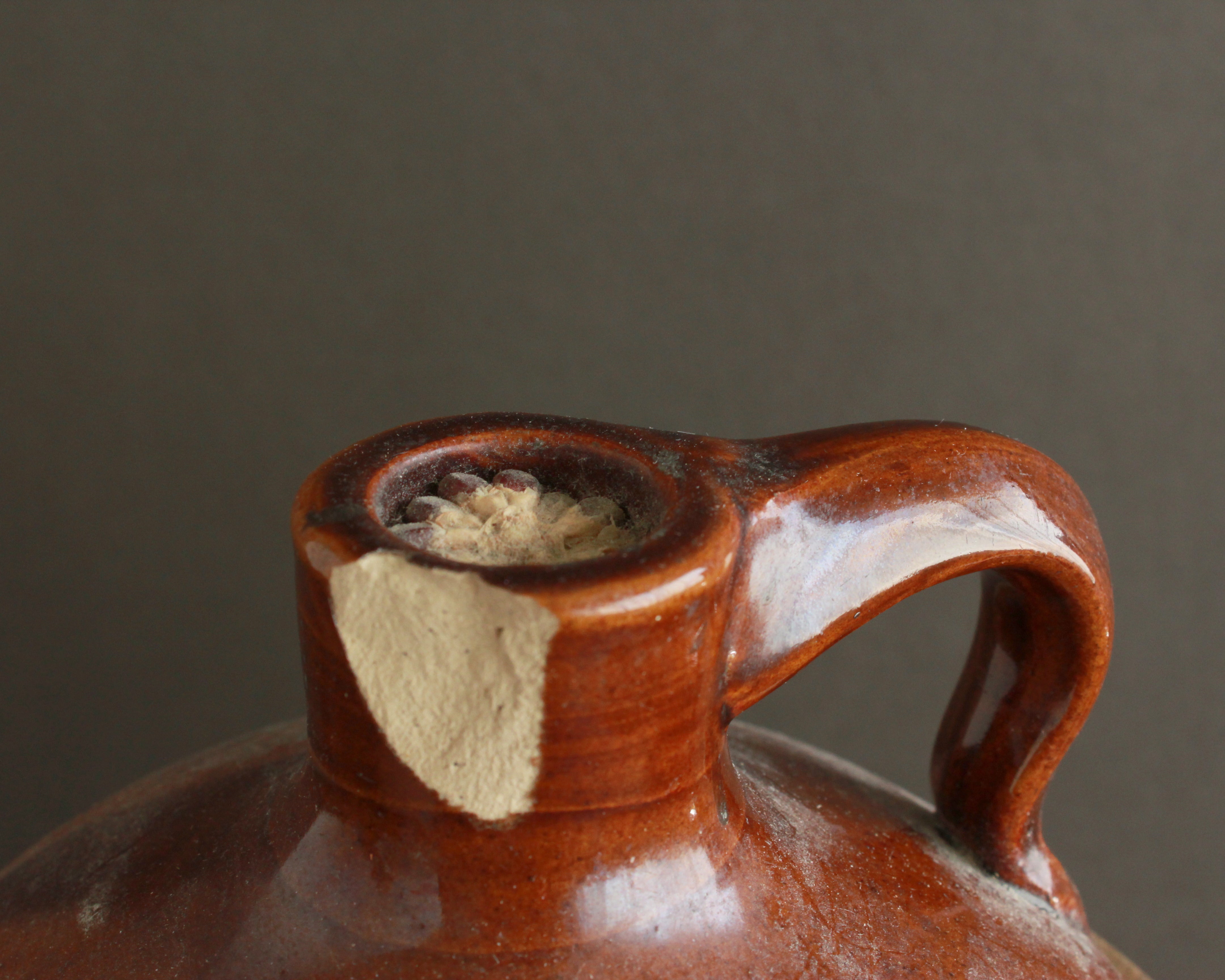 antique brown and white ceramic jug