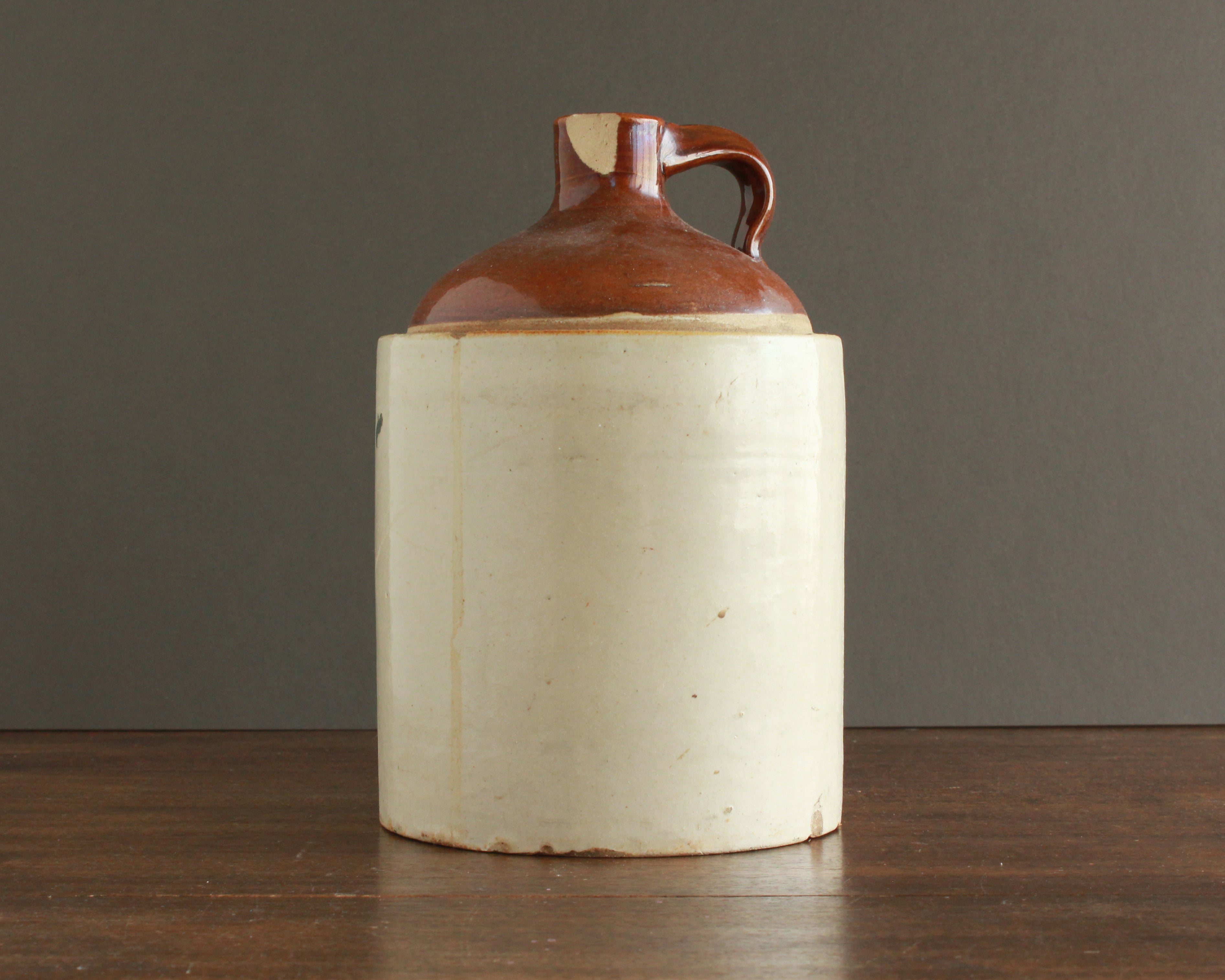 antique brown and white ceramic jug
