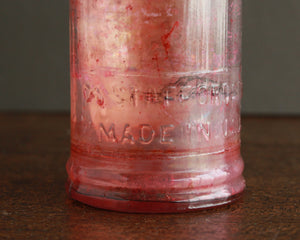 antique ink bottle with paper label and cork