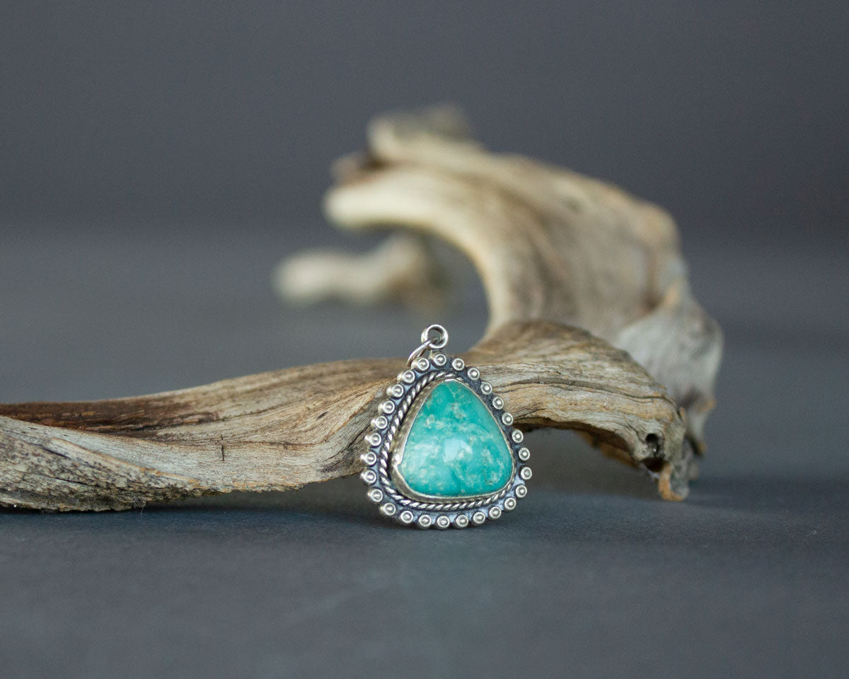 Triangular turquoise pendant in sterling silver