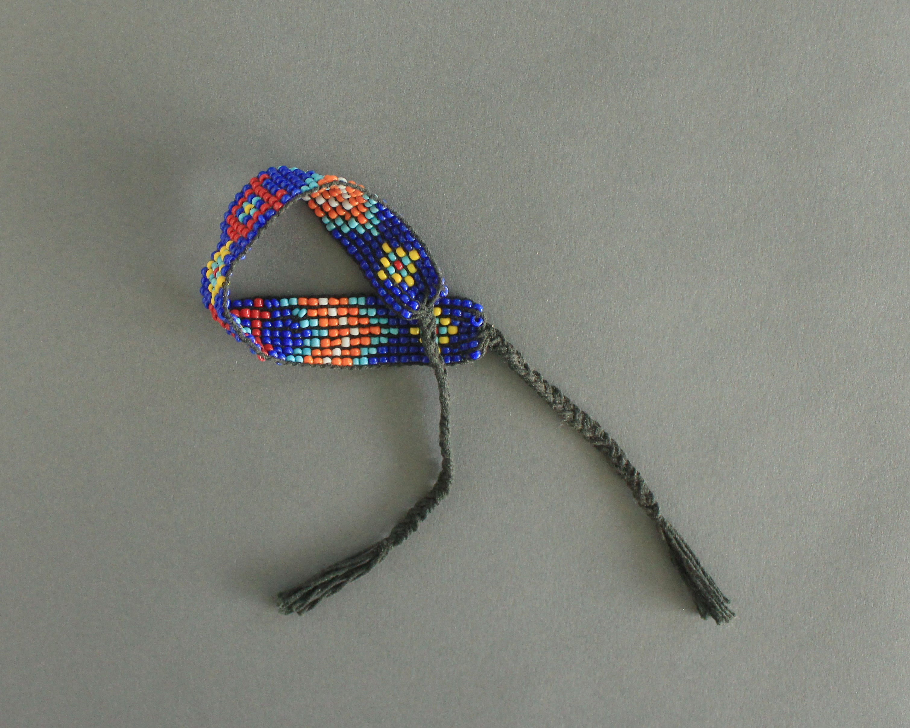 Beaded tribal bracelet or anklet in blue and orange 