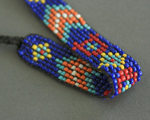 Beaded tribal bracelet or anklet in blue and orange 