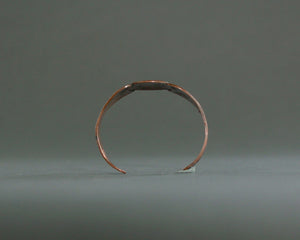 Vintage copper cuff with geometric overlay design 
