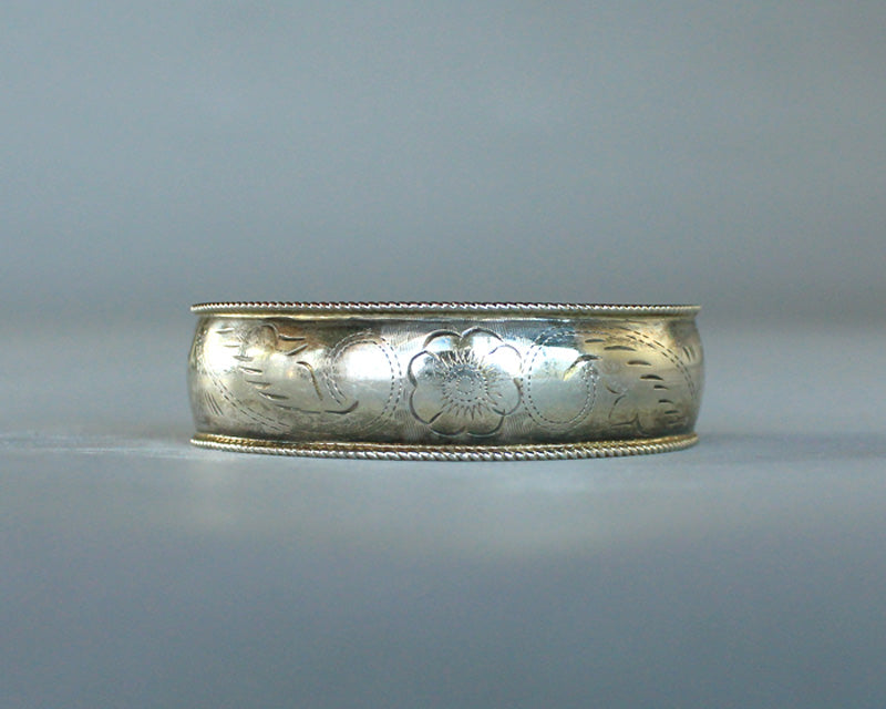 Engraved silver bracelet with flower