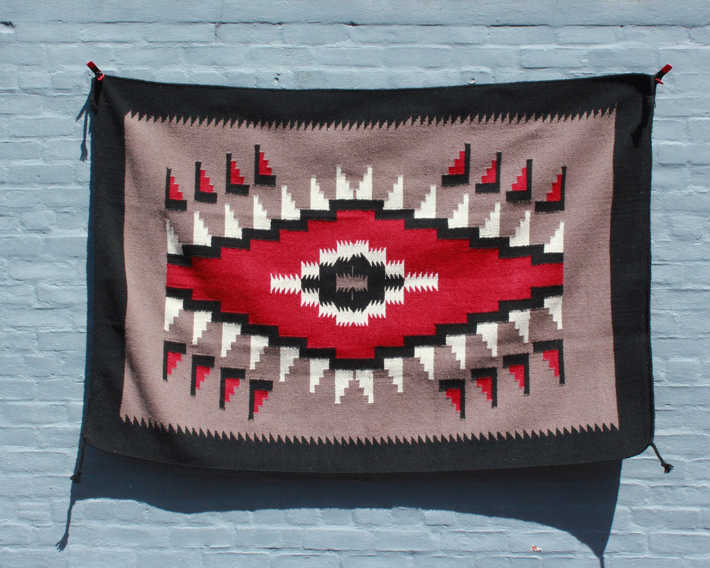 Southwest hawkeye print rug in tan, black and red wool