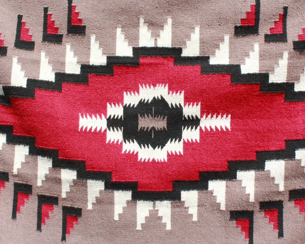 Southwest hawkeye print rug in tan, black and red wool