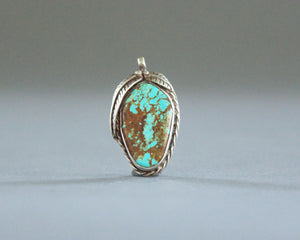 large turquoise pendant with brown matrix
