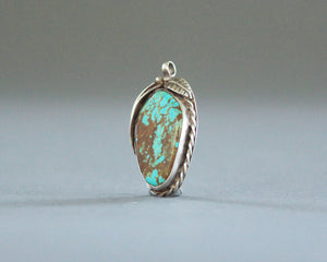 large turquoise pendant with brown matrix