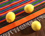 Handwoven Mexican table runner in orange stripe
