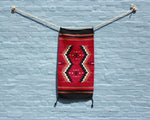 Southwest cross print wool accent rug in red and black 