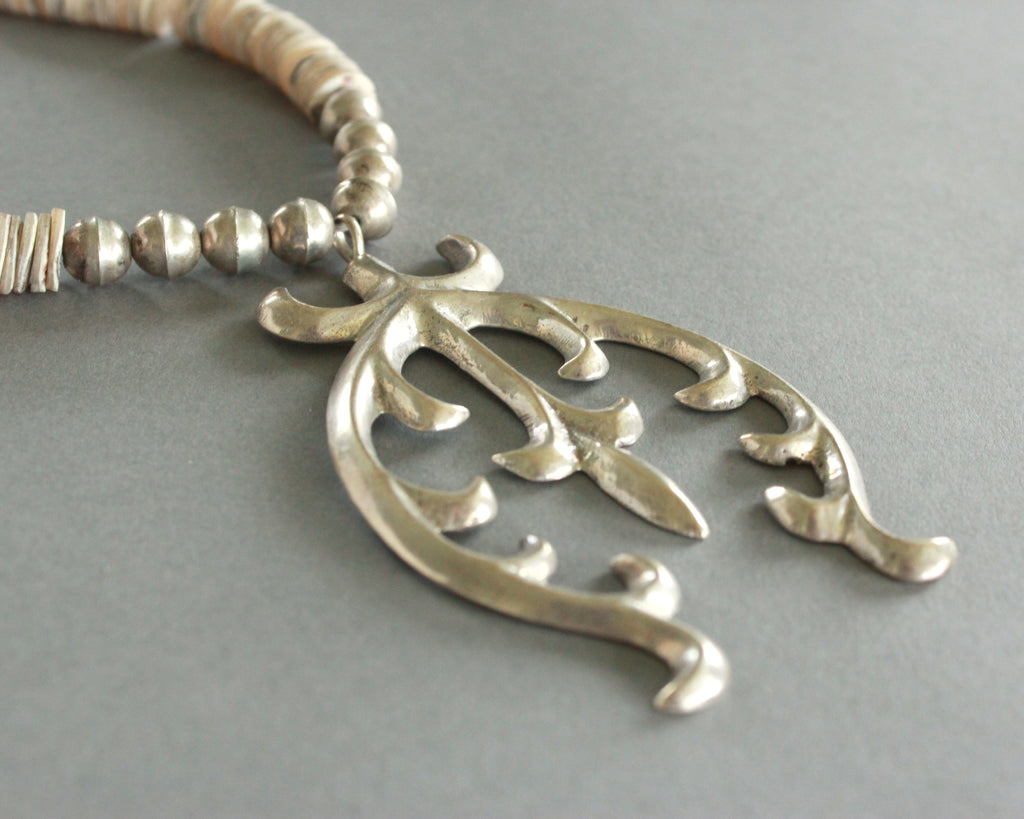sand cast naja necklace with shells and silver beads