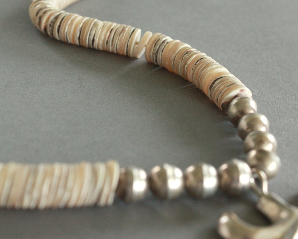 sand cast naja necklace with shells and silver beads