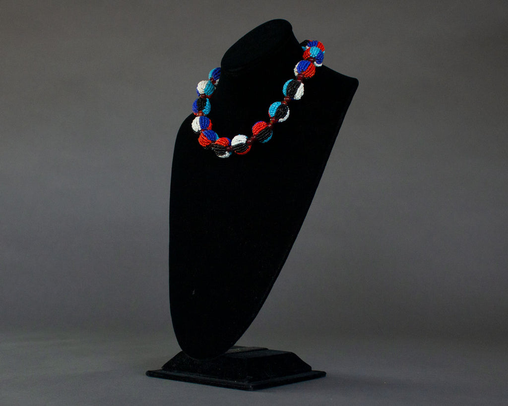 Ball necklace in red, white, blue, and black