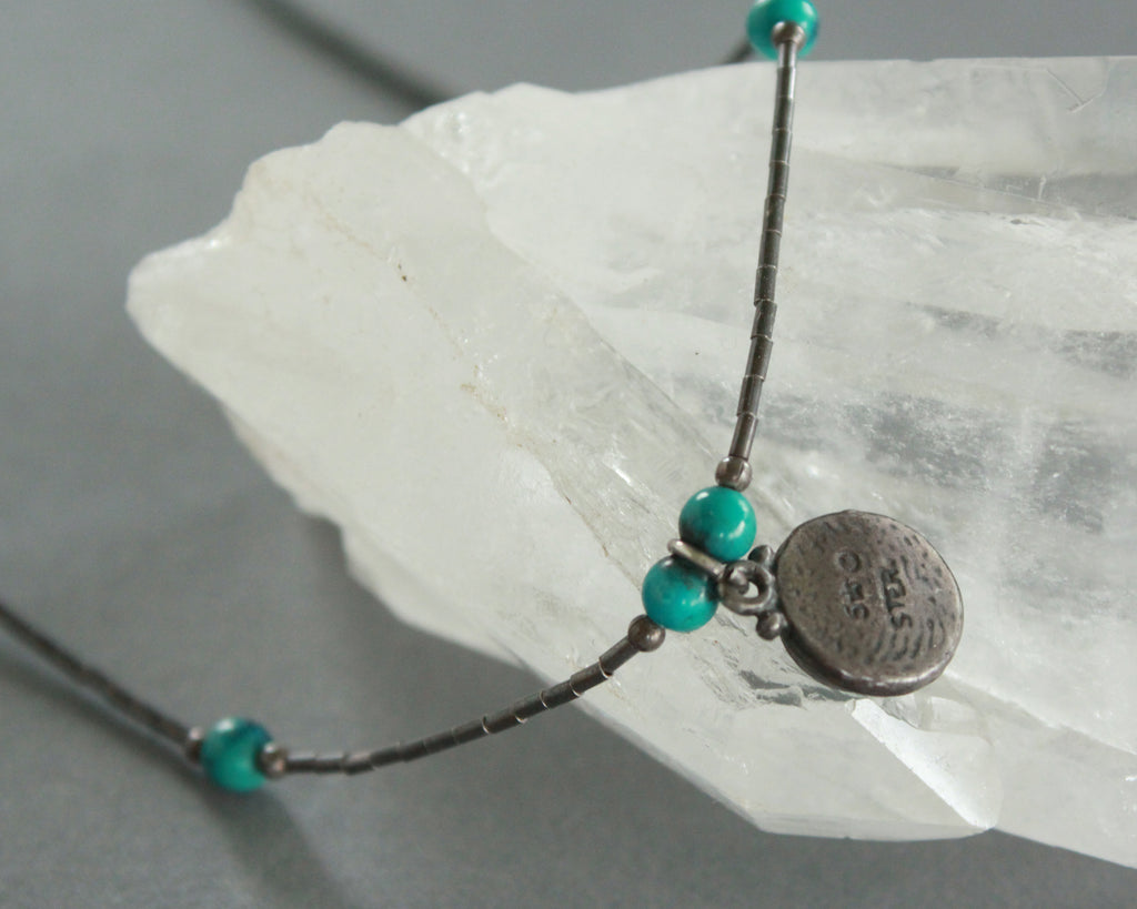 tarnished liquid silver necklace with teal pendant 