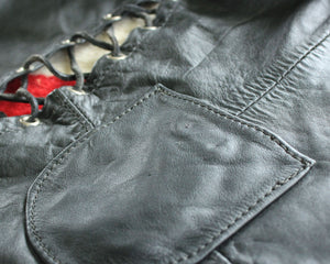Vintage womens black leather biker vest with patches and pins, size small