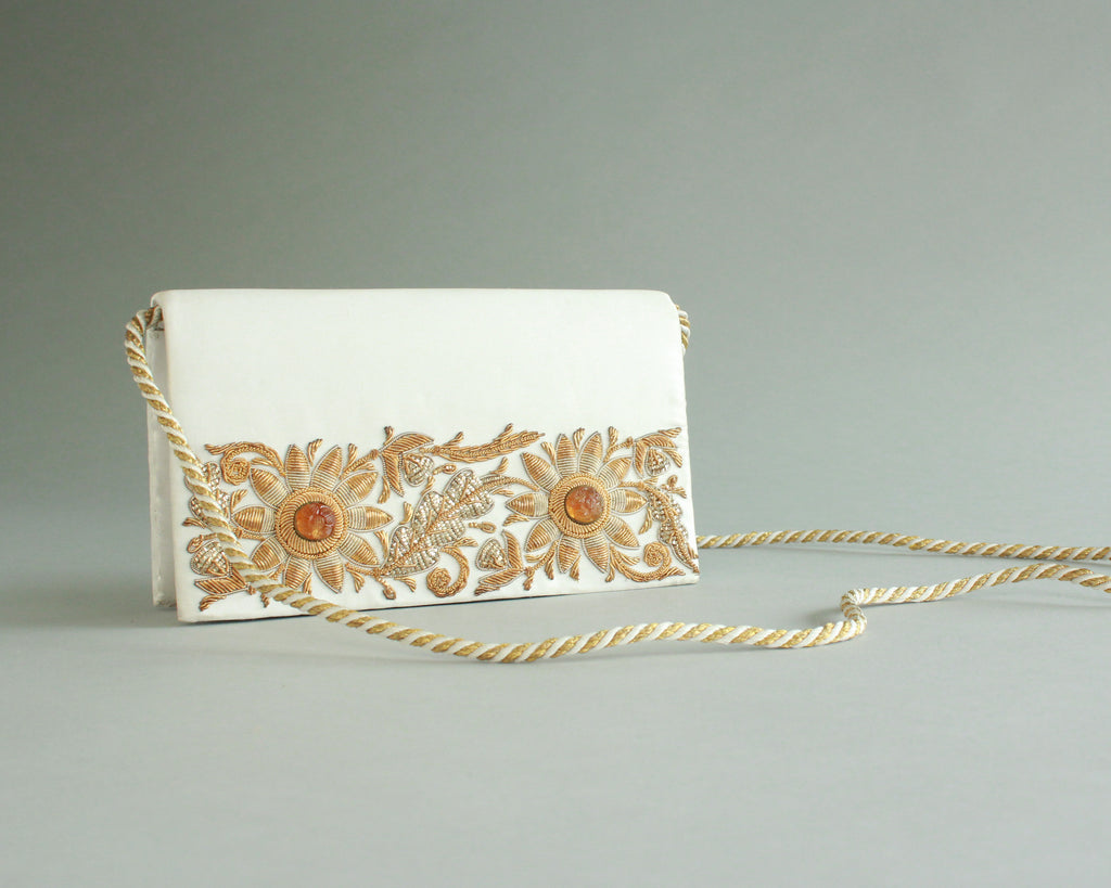 White satin purse with gold hand beading on both sides